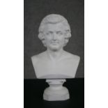 A Parian ware bust of Mozart, the bust inscribed below and on plinth base. H.30 W.18 D.10cm