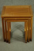 A nest of three vintage teak occasional tables. H.49 W.48 D.42cm. (largest)