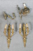 A pair of Adam style twin branch brass wall lights, together with a brass single branch wall light