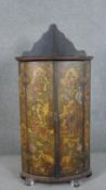 A late 18th century George III painted hanging corner cabinet, in the Chinoiserie style, the bow
