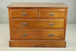 A circa 1900 walnut chest, the rectangular top with a moulded edge over two short and two long