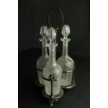 Three Edwardian etched floral and foliate design crystal decanters with stoppers in a repousse