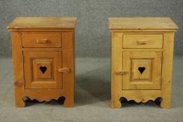 A pair of late 20th century pine bedside cabinets, with a single drawer over a cupboard door with