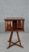 After George Montague Ellwood (1875-1955), an Arts & Crafts / Art Nouveau mahogany revolving