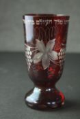 A 19th century ruby cut to clear Bohemian glass Kiddush cup, with engraved vine and Jewish character