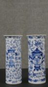 A near pair of Chinese blue and white porcelain vases, of cylindrical form with a flared rim, with