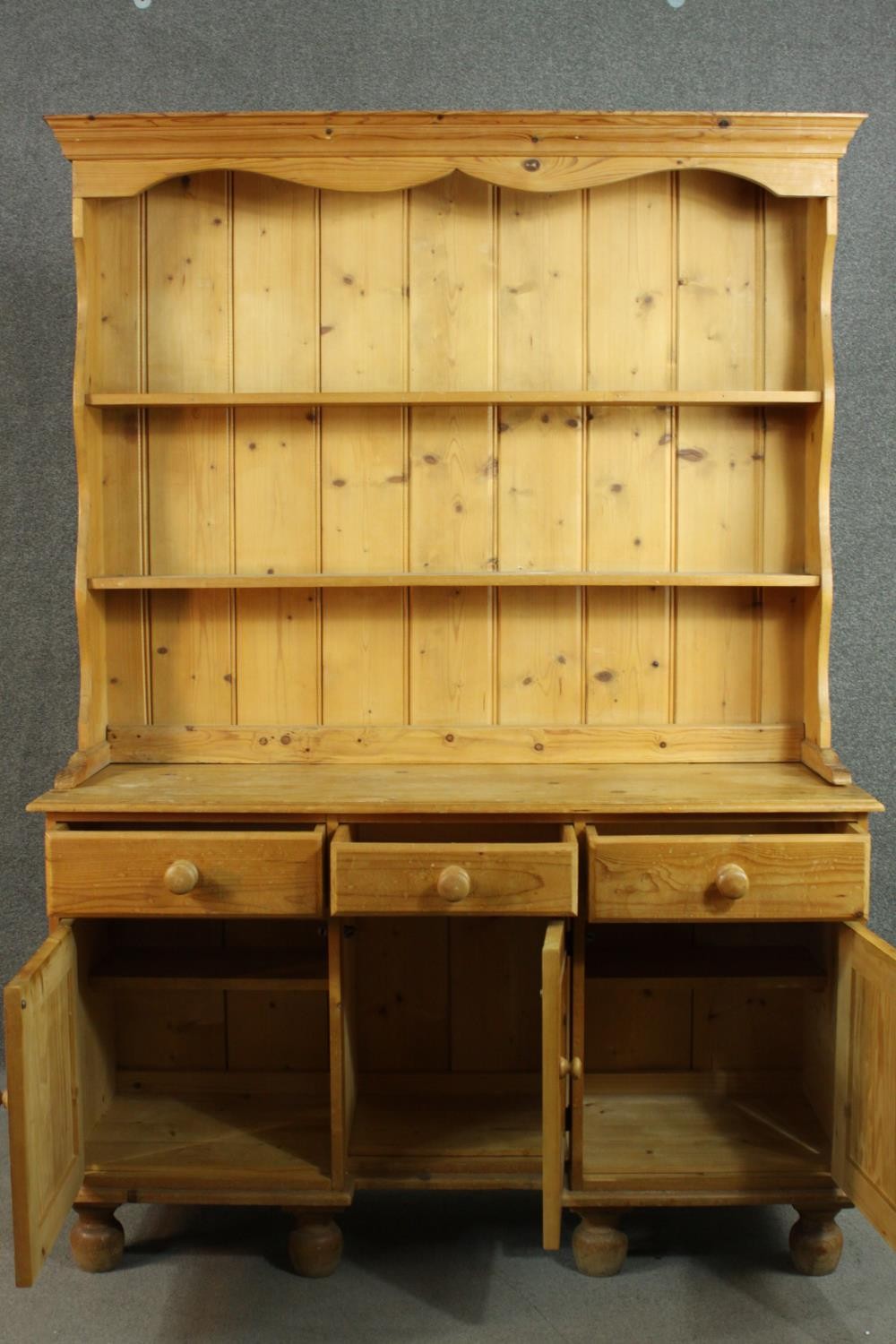 A Victorian style pine kneehole dresser with open plate rack above three short drawers over three - Image 5 of 8