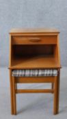 A mid 20th century teak Chippy telephone table and seat, with slide, drawer, and recess over a slide