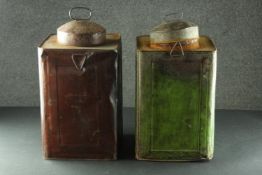 Two painted steel ship's lanterns, one green and one red with carrying handles. H.45 W.24 D.24cm.