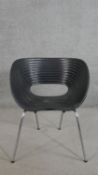 A Ron Arad Tom Vac black polypropylene chair, the seat of oval ribbed form, on tubular chromed legs.