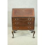 An 18th century style Edwardian mahogany bureau, the fall front revealing drawers, pigeonholes and a