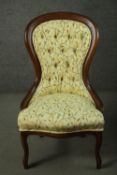 A contemporary late 19th century style stained beech spoon back chair, upholstered in light yellow