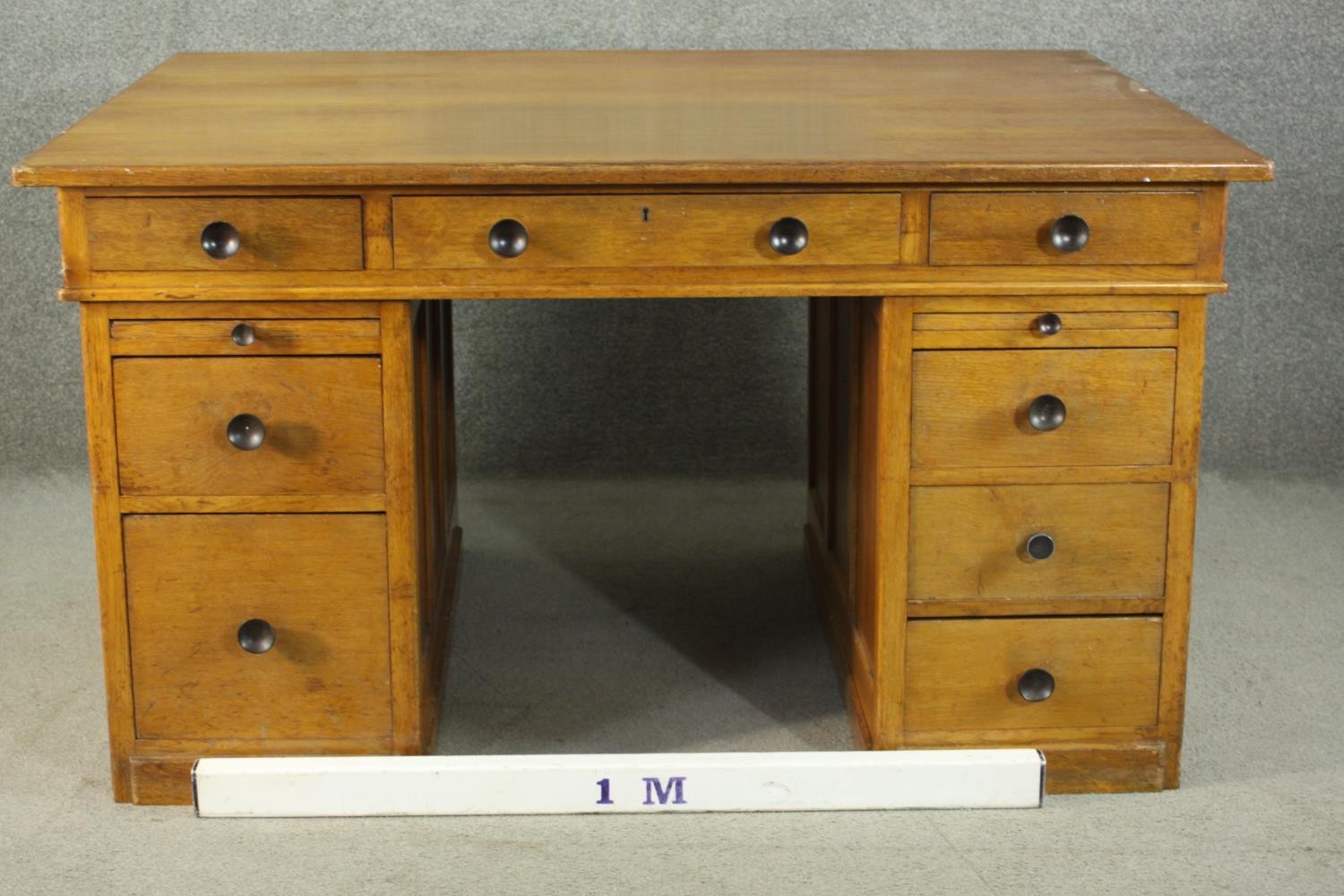 An early to mid 20th century oak pedestal desk, with three short drawers, over two slides, above two - Image 2 of 9