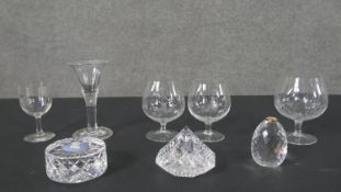 A collection of cut glass, including a pair of etched brandy glasses decorated with ladies