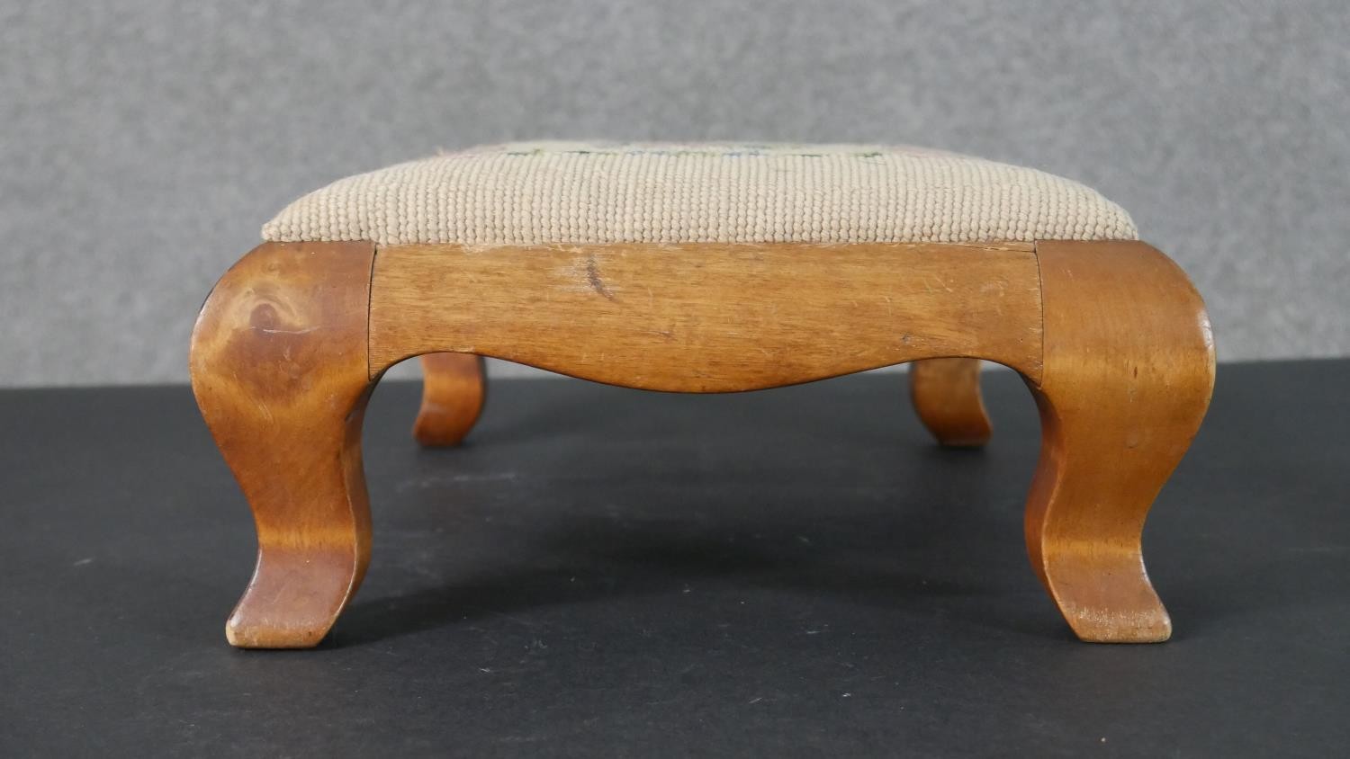 A satinwood footstool, with an embroidered seat, on cabriole legs. H.12 W.35 D.26cm - Image 5 of 5