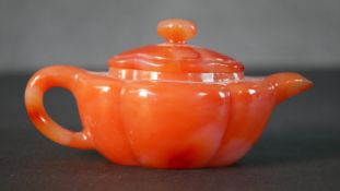 A carved carnelian Chinese tea pot. H.8 W.15cm