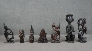 A collection of six carved Tribal African figures and a Chinese carved immortal. H.55cm (largest)