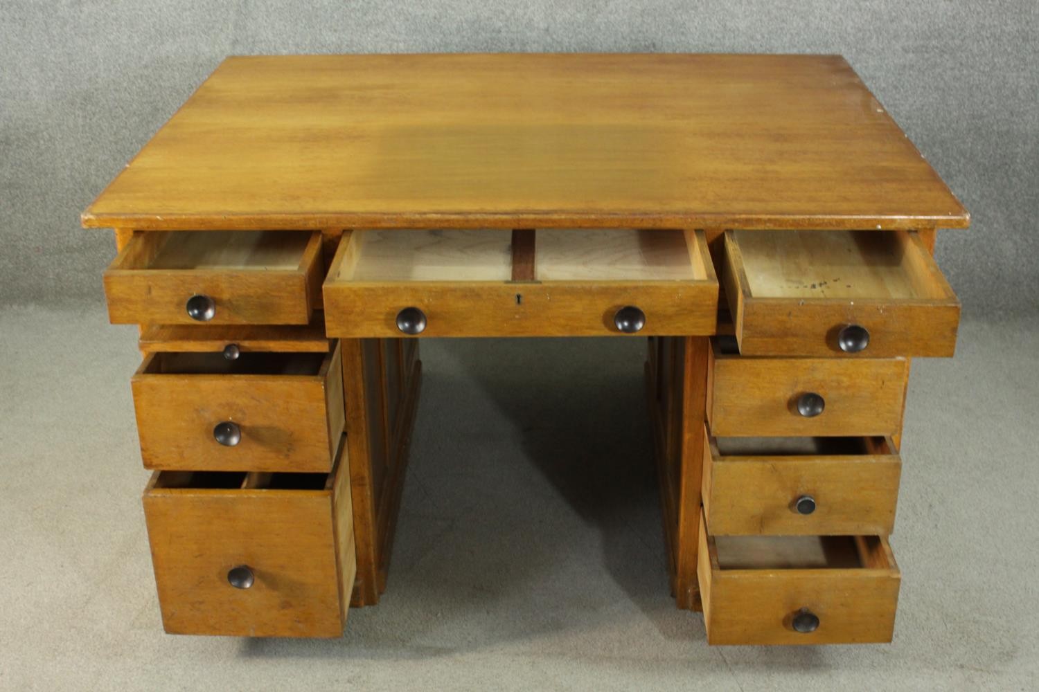 An early to mid 20th century oak pedestal desk, with three short drawers, over two slides, above two - Image 4 of 9
