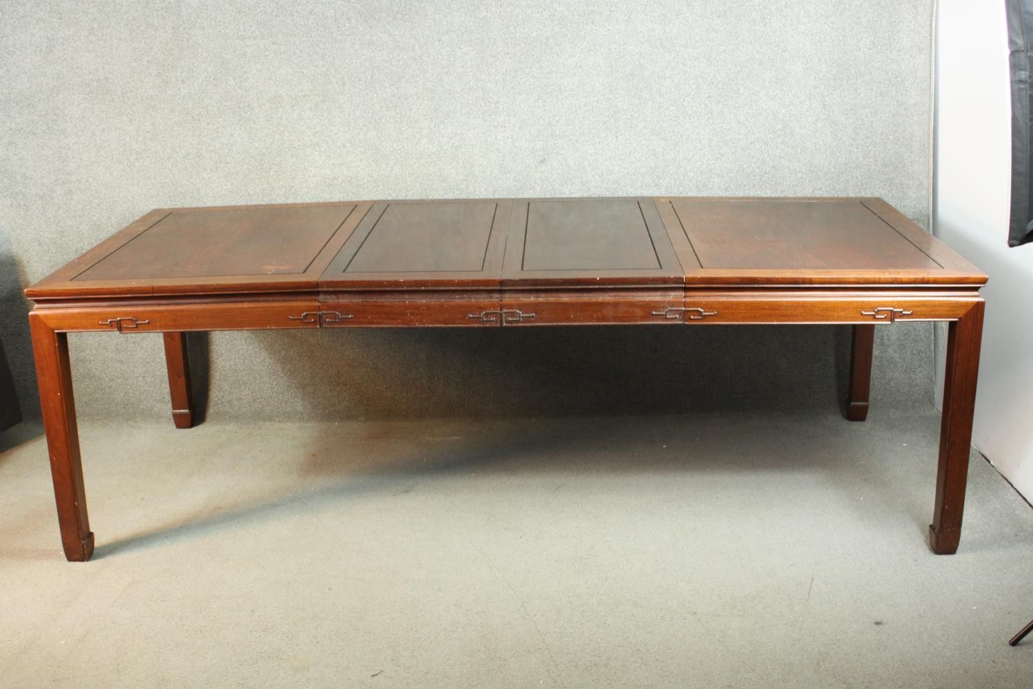 A late 20th century Chinese rosewood dining table, with a rectangular top and two additional leaves, - Image 3 of 14
