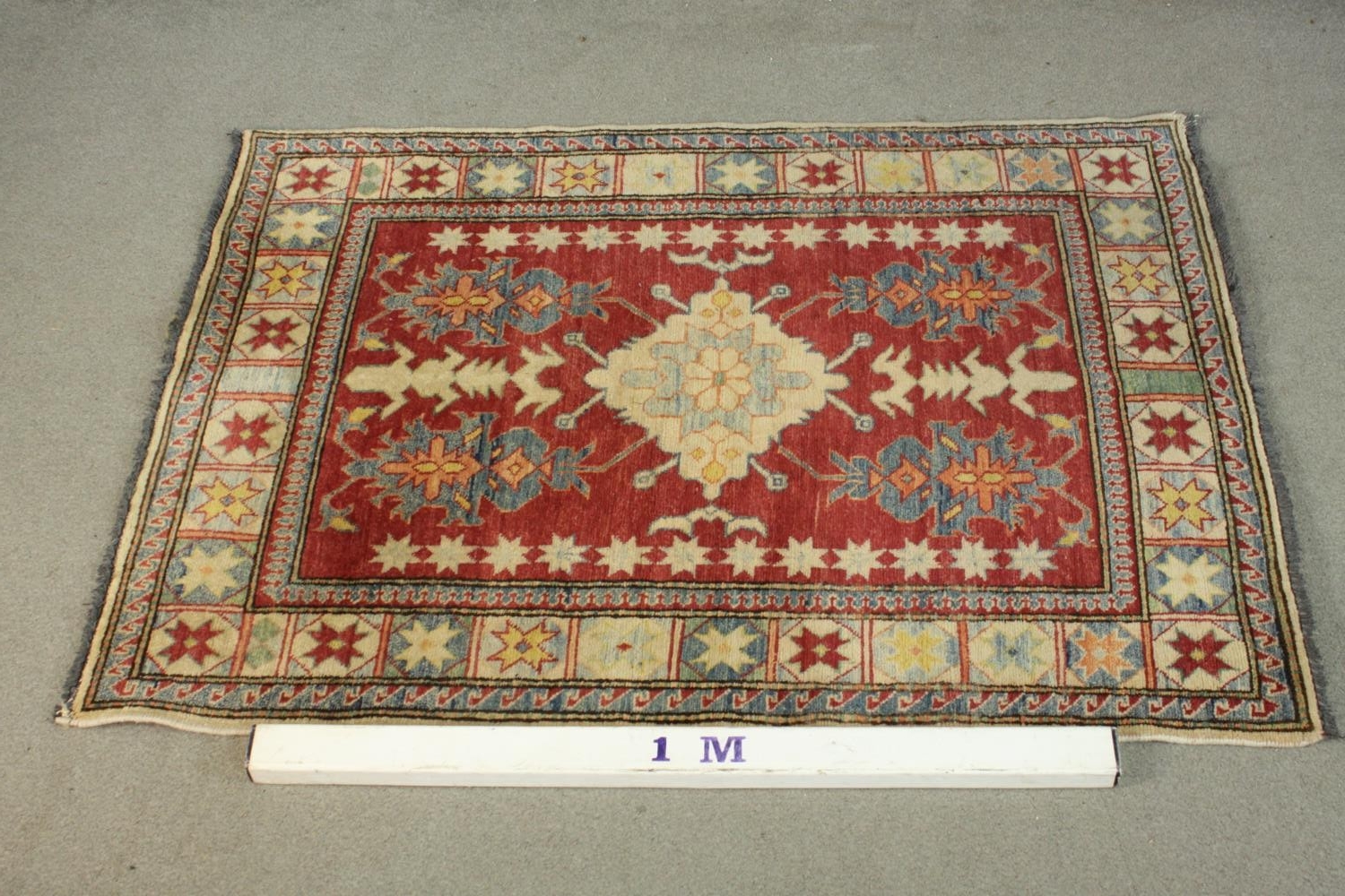 A hand made red ground Chechen Kazak rug. L.150 W.115cm. - Image 2 of 6