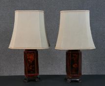 A pair of Chinese style painted table lamps, with canted corners, on four feet, painted with
