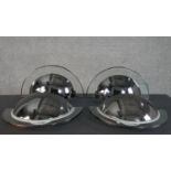 Two pairs of mid century Estiluz chrome and glass semicircular design wall lights, with makers