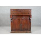 A Victorian mahogany chiffonier, surmounted by a section with two pairs of short drawers, over a