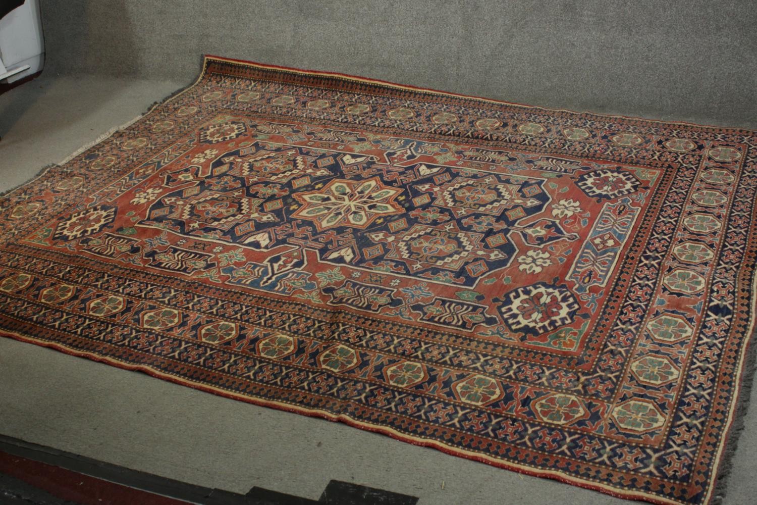 A hand made blue ground Chechen carpet. L.266 W.220cm. - Image 2 of 6