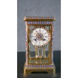 A Japy Freres French 19th century gilt brass and enamel mercury pendulum clock. The face enamelled
