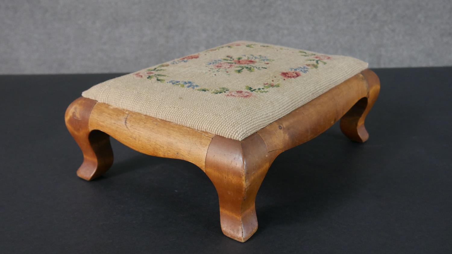 A satinwood footstool, with an embroidered seat, on cabriole legs. H.12 W.35 D.26cm - Image 2 of 5