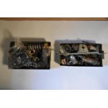 A collection of various car parts, including suspension springs, solenoid, a headlamp,
