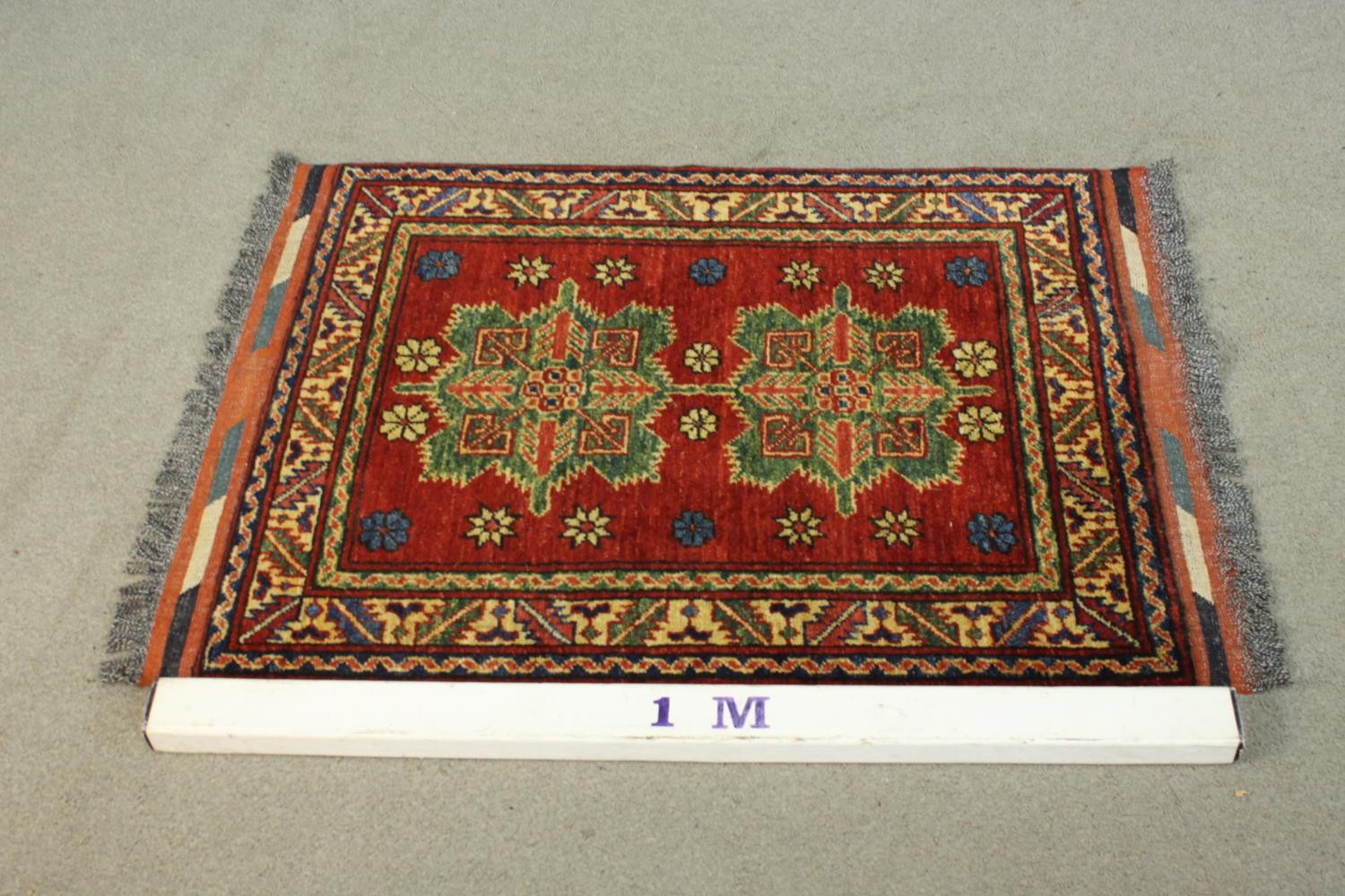 A hand made red ground Chechen rug. L.105 W.78cm. - Image 2 of 5