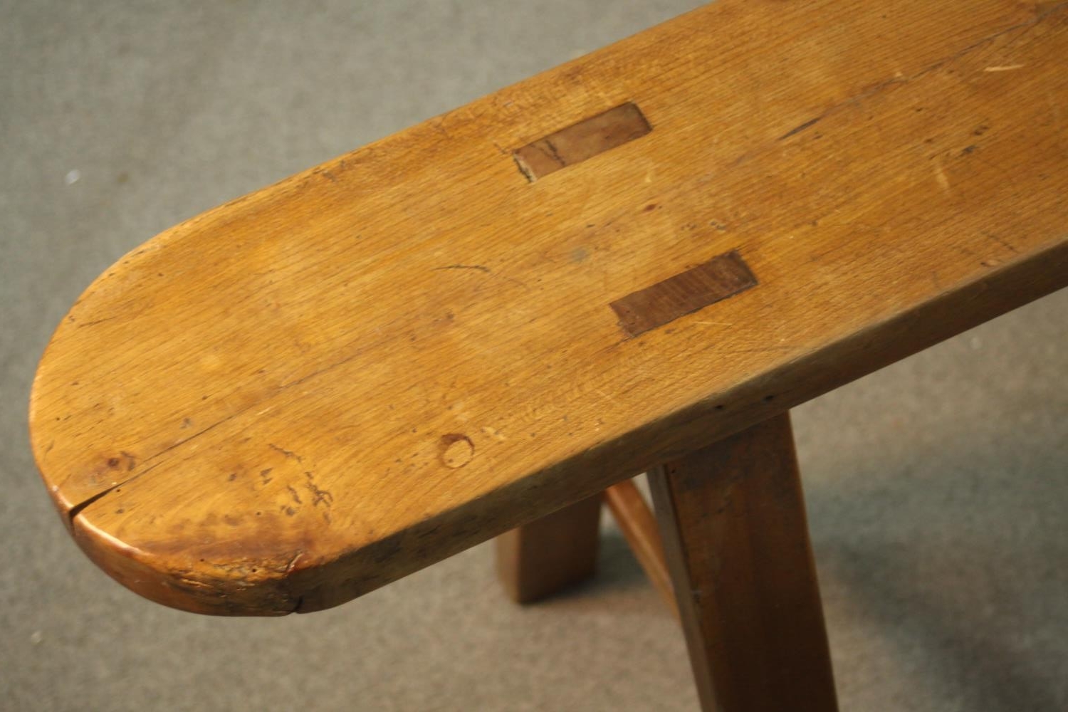 A pair of 19th century French provincial oak benches, the plank tops with rounded ends, on splayed - Image 4 of 8
