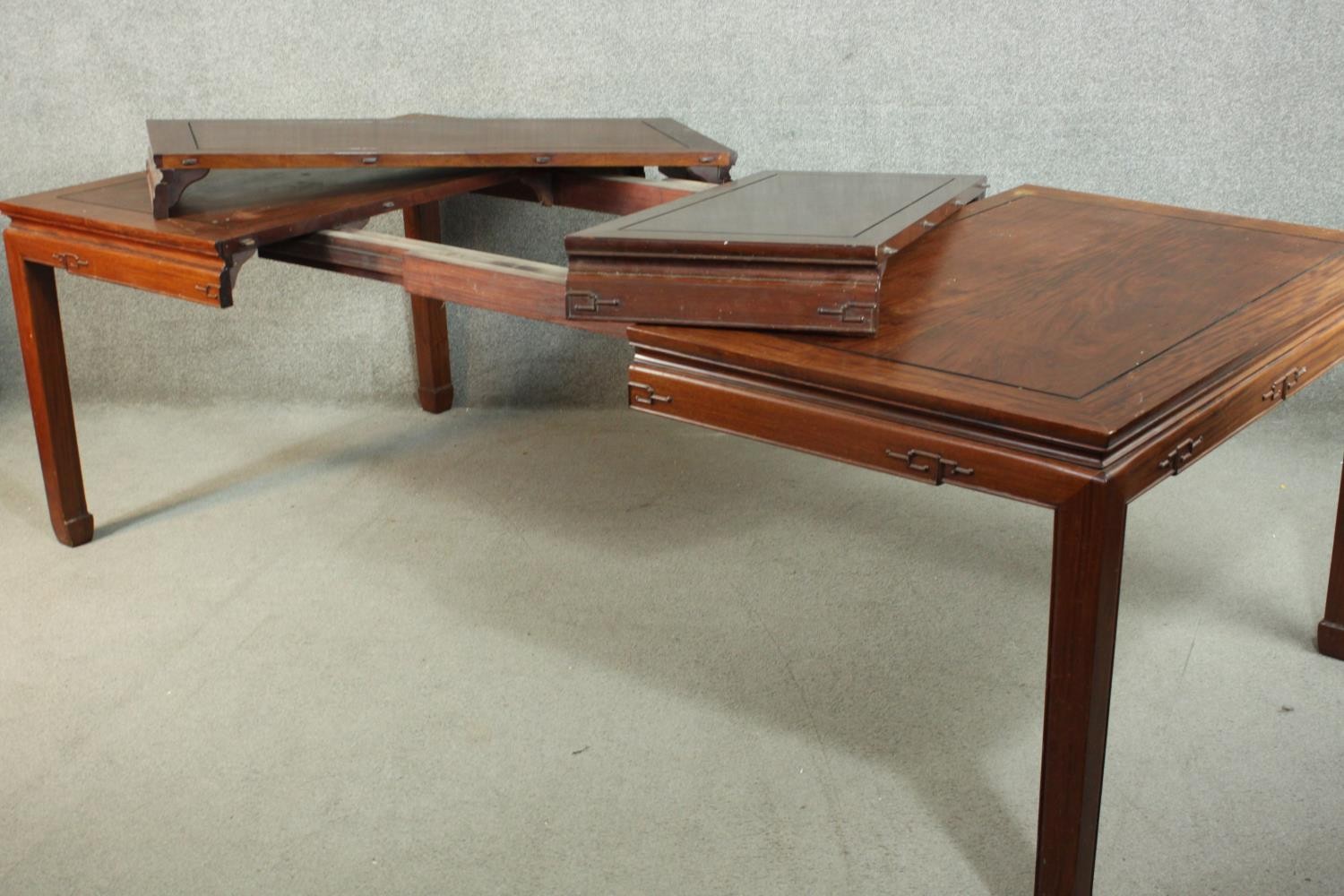 A late 20th century Chinese rosewood dining table, with a rectangular top and two additional leaves, - Image 9 of 14