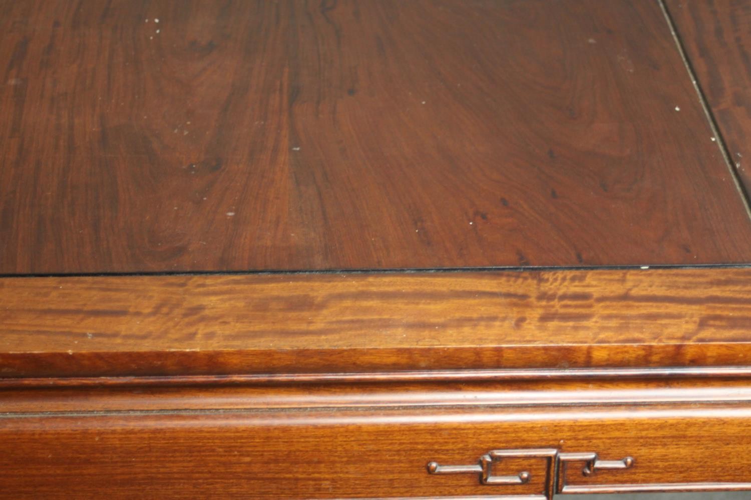 A late 20th century Chinese rosewood dining table, with a rectangular top and two additional leaves, - Image 4 of 14