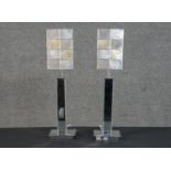 A pair of contemporary mirrored table lamps, the base formed from panels of bevelled mirror, the