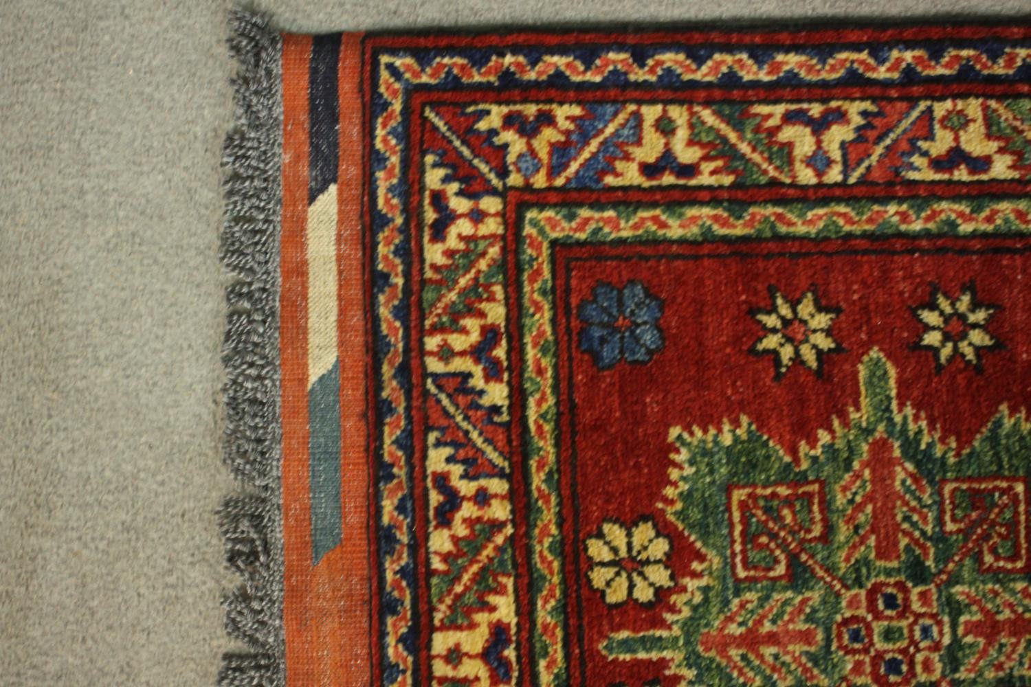 A hand made red ground Chechen rug. L.105 W.78cm. - Image 4 of 5