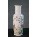 A Chinese porcelain hand painted vase decorated with a rooster, hen and chicks under a blossom tree.