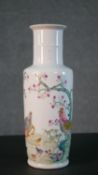 A Chinese porcelain hand painted vase decorated with a rooster, hen and chicks under a blossom tree.