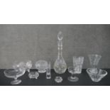 A large collection of crystal, including a decanter with stopper, various designs of vases and other