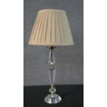 Three crystal stem and brass table lights, two small and one larger. All with cream silk shades. H.