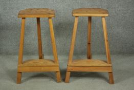 A pair of 20th century pine bar stools, the seat with two canted corners, on splayed square
