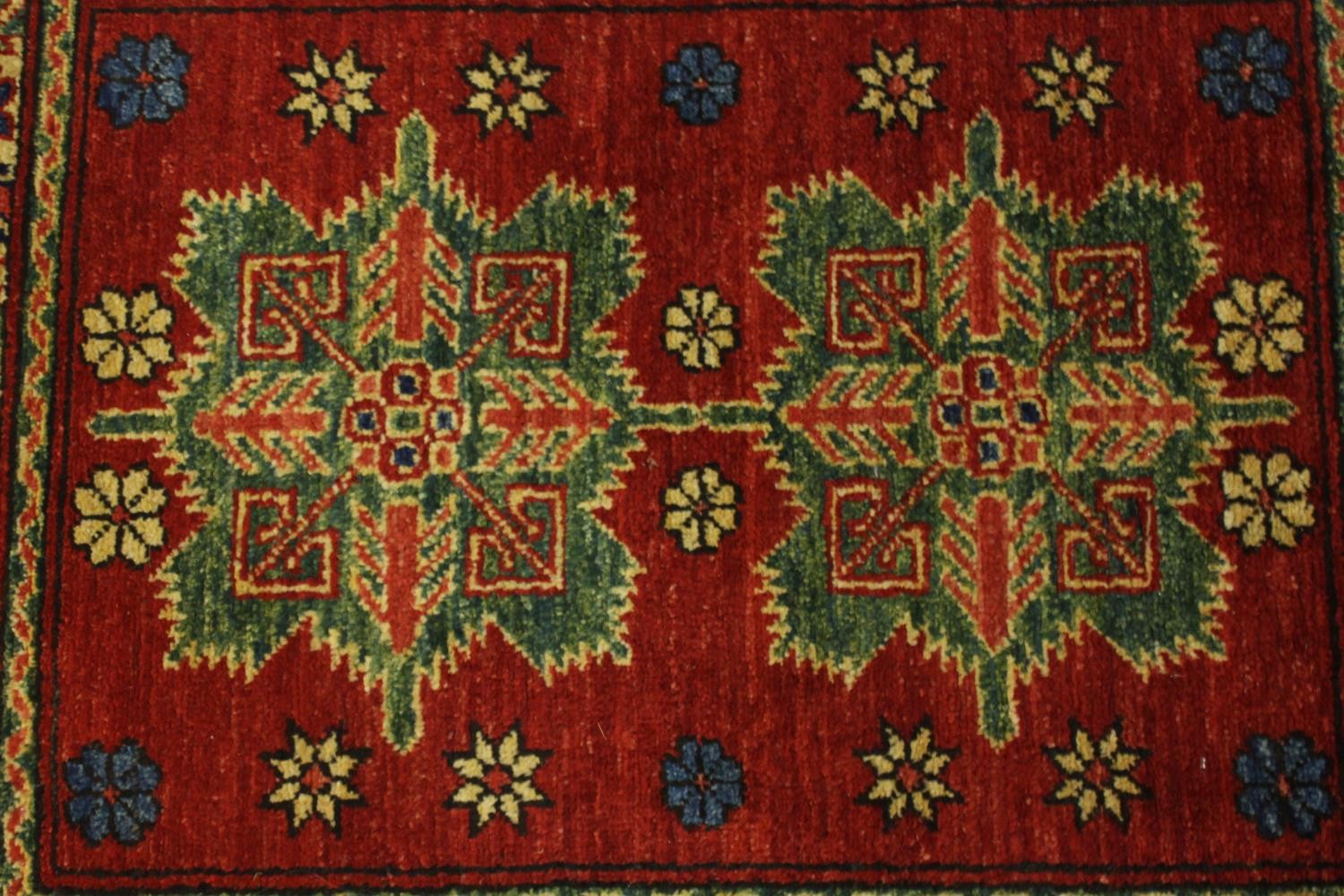 A hand made red ground Chechen rug. L.105 W.78cm. - Image 3 of 5