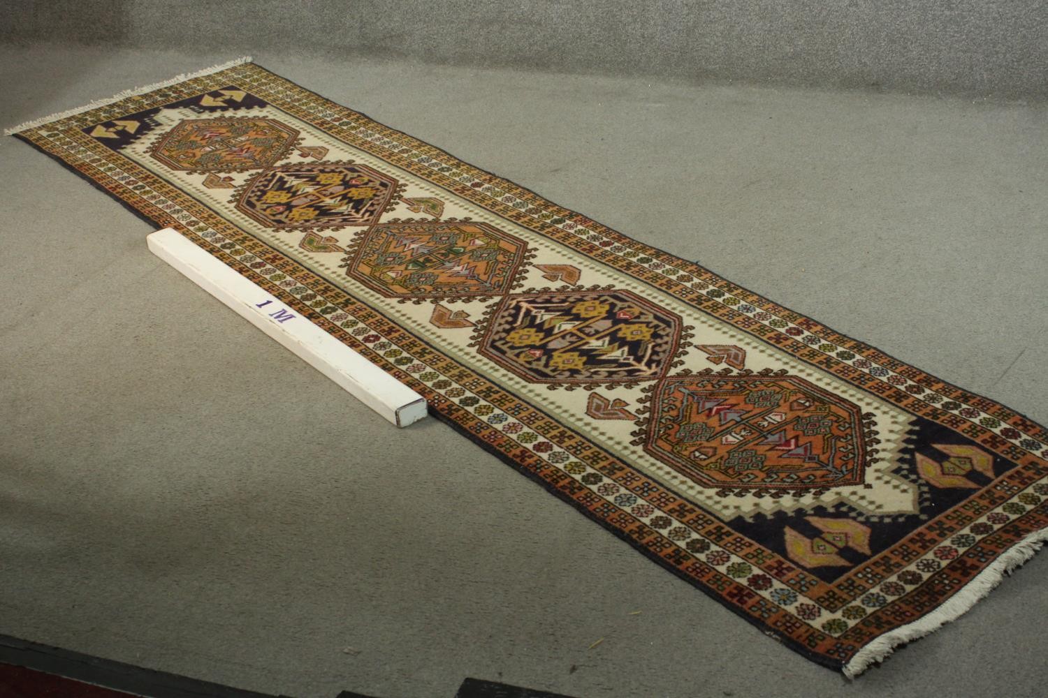 A hand made beige ground Russian Kazak runner. L.290 W.72cm. - Image 2 of 5