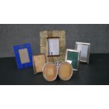 A collection of easel backed picture frames, including three silver picture frames. H.26 W.21cm (