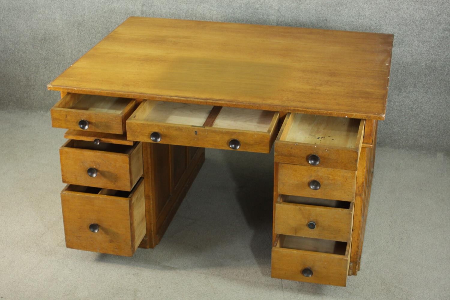 An early to mid 20th century oak pedestal desk, with three short drawers, over two slides, above two - Image 6 of 9