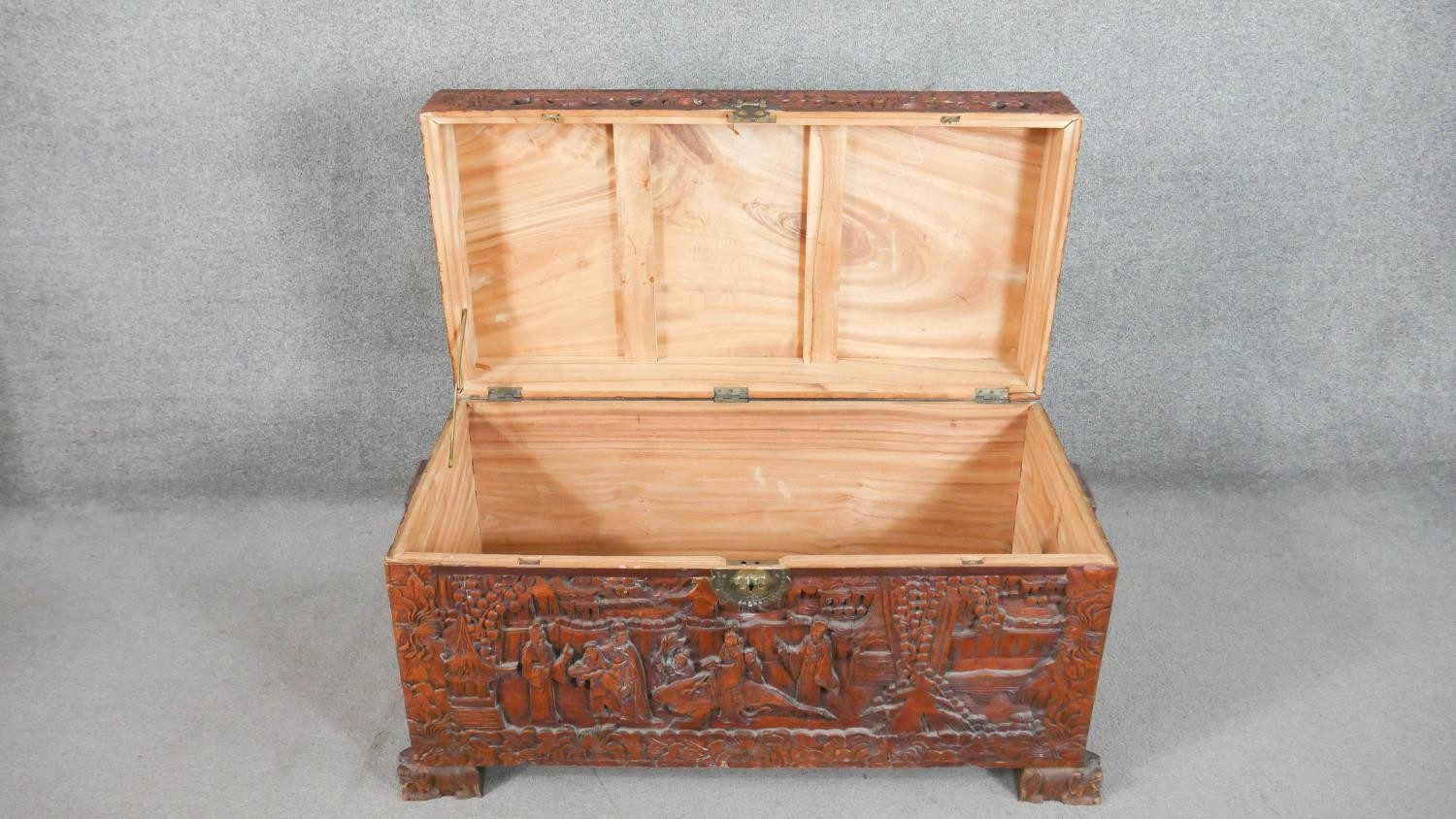 A 20th century Chinese camphorwood coffer, of rectangular form, the lid and sides ornately carved - Image 6 of 9