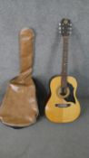 A cased acoustic Kay K320 guitar.