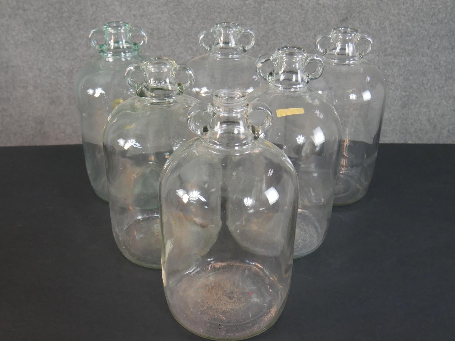 A collection of eight glass demijohns, one brown and one green glass. H.38cm (largest) - Image 4 of 4