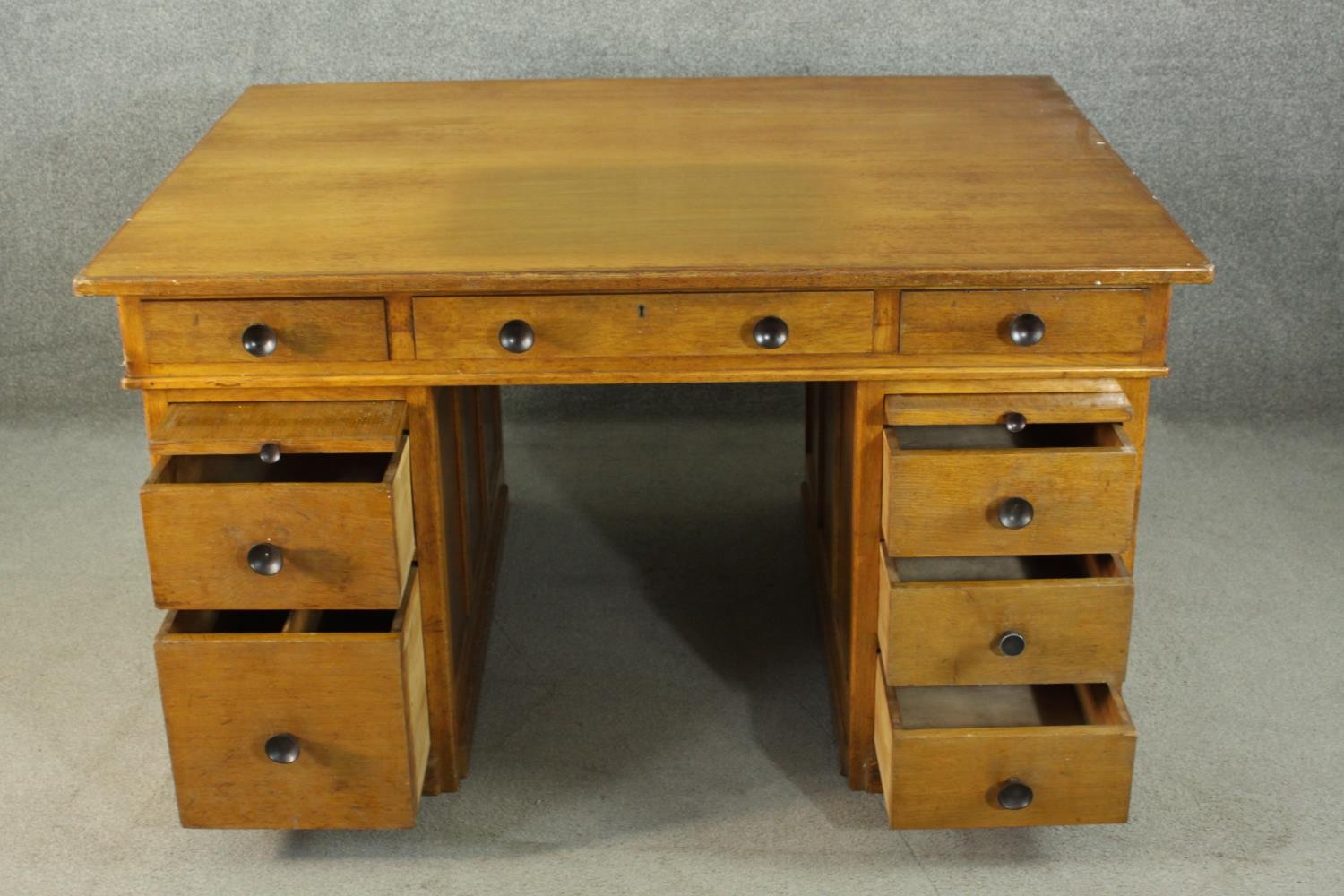 An early to mid 20th century oak pedestal desk, with three short drawers, over two slides, above two - Image 3 of 9
